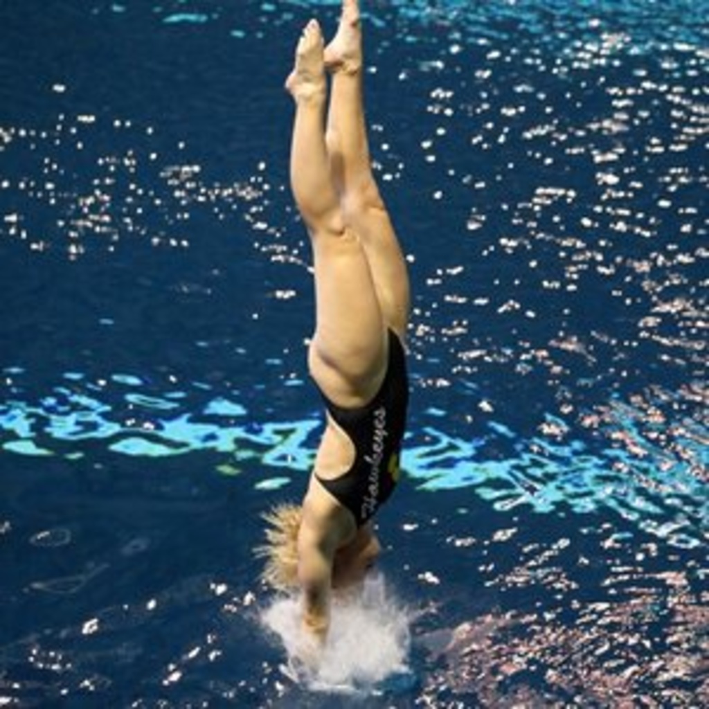 Women diving into water