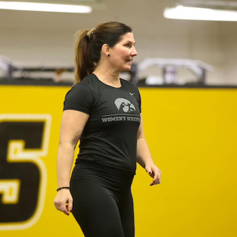 Assistant Women's Wrestling Coach Tonya Verbeek stands at practice