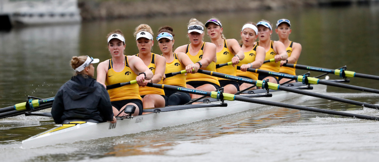 Eight rowers in a boat on the Iowa River